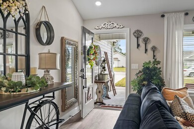 Foyer with light hardwood / wood-style flooring an