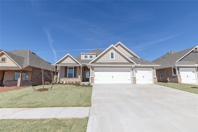 Craftsman house featuring a garage, concrete drive