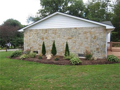 BEAUTIFUL STONE SIDING MAKES THIS AN APPEALING LAK