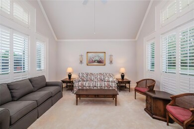 Formal living room with vaulted ceiling.