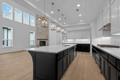 Kitchen featuring light countertops, under cabine