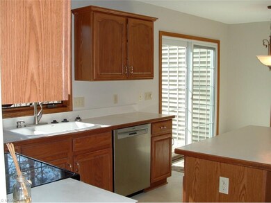 The kitchen contains an island, pantry, and tons o