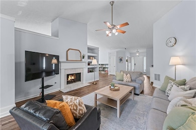 Living room featuring wood finished floors, a ceil