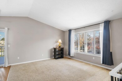 Open floor plan with vaulted ceilings, large windows, and professionally cleaned carpet throughout