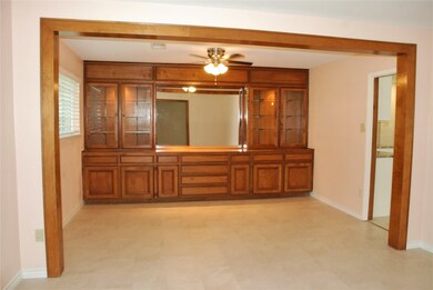 The Dining Room features and wood cased opening from the Living Room and a built-in buffet.