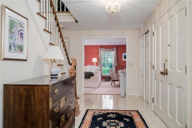 Gracious foyer with 2 guest closets welcomes you t