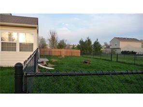 Exterior Back. Large fenced in yard. Sunroom.