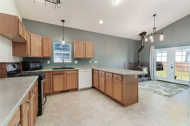 Kitchen, dining area and door to back patio.