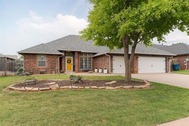 Ranch-style house featuring a front lawn and a gar