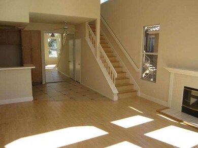 Living room with cozy fireplace, laminate flooring