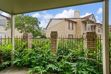 Step through the sliding glass doors to your private patio, a perfect space to create your outdoor retreat. Enjoy lush greenery and a wrought iron fence that lets you take in the landscaping without any of the maintenance. A serene spot to relax or entertain right at home.
