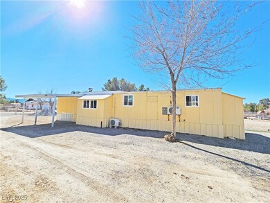 View of property exterior featuring a carport