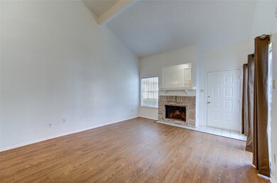 A cozy living space featuring large windows and a