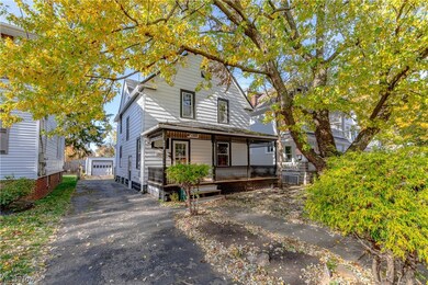 View of front of house with a garage and a porch