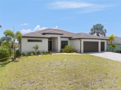 Prairie-style house with a garage, decorative driv
