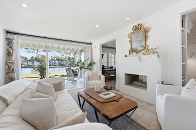 Living area with a water view and recessed lighting