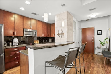 Kitchen featuring appliances with stainless steel