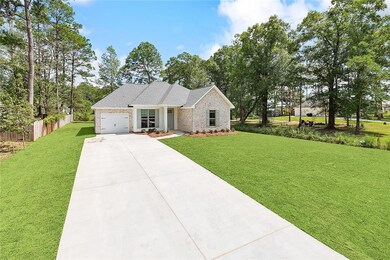 Long driveway w/ plenty of room for vehicles.
