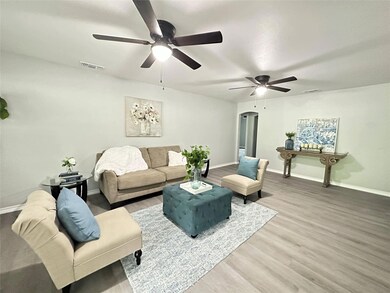 Living room with hardwood / wood-style floors and 