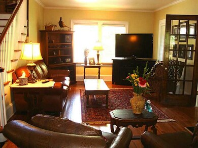 Living Room. With gorgeous hardwood flooring & a gas log fireplace!