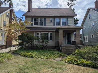View of front facade with a porch and a front yard