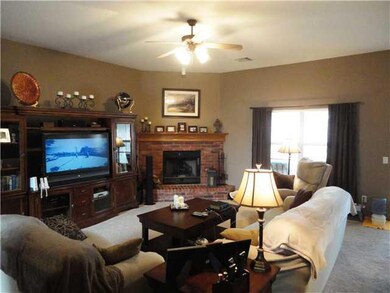 Living Room. Living room has 10  ceilings and a fi