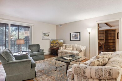 The great room is open to the den through double French doors.  The sliding glass doors open to a three season porch.  The floor plan of this unit is well planned.