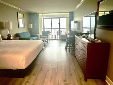 Bedroom featuring light wood-type flooring and ornamental molding