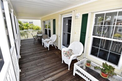 Screened / roofed front porch.