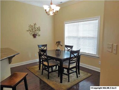 Breakfast/dining area is just off the kitchen and features high ceilings, large window overlooking the backyard and hardwood floors.