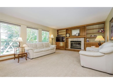 The main level family room boasts a woodburning fi
