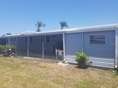 South side of property looking towards carport and shed.