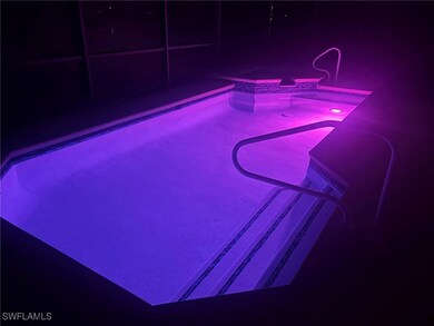 Swimming pool with a hot tub and a balcony