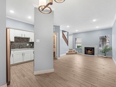 View from dining area with wood burning fireplace.