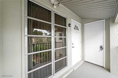 Property entrance featuring covered porch