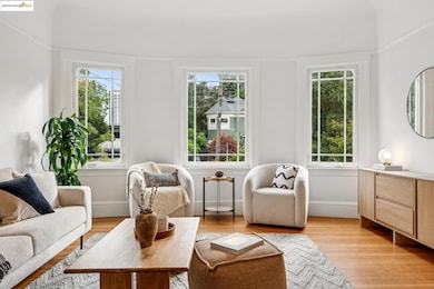 Living room with healthy amount of natural light and light wood-type flooring