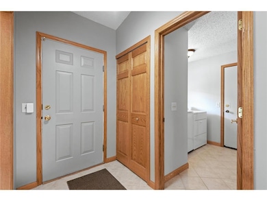 Inside front entry with view to laundry room (with