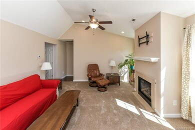 Vaulted ceiling, gas fireplace and new carpet in t