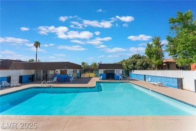 Community pool featuring a patio area