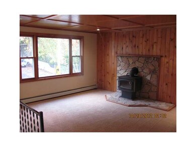 Living Room. LARGE LIVING ROOM WITH COZY WOOD STOV