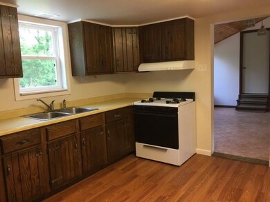 Bright kitchen with a window onto the lovely back 