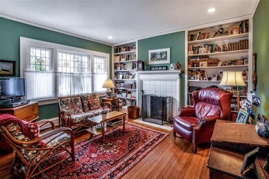 A cozy den to relax by the gas log fireplace with 