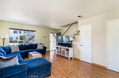 Living room with direct access to attached garage and powder room.
