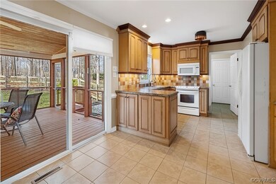 Kitchen is open to the rear screened porch!