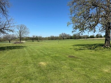 View of green lawn featuring a view of rural / pastoral area