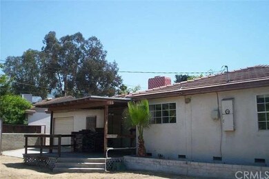 BACK OF HOUSE.GARAGE HAS 2 DOORS TO DRIVE TO BACK 
