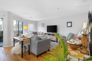 Living area featuring wood finished floors and baseboards
