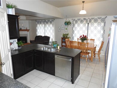 Kitchen with pantry into dining and family room