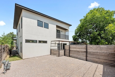 Rear view of property featuring a fenced backyard