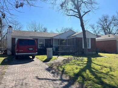 Single story home with a chimney, a front lawn, de